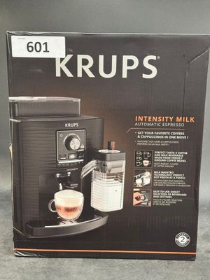 the box of the coffee machine is open on the table