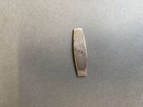 a small piece of metal that is on a table