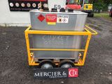a large metal container sitting on top of a cart