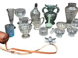 a lot of glass items that are sitting on a table