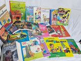 many children ' s books that are on the table
