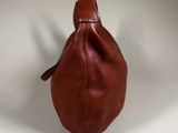 brown leather handbag on a white background
