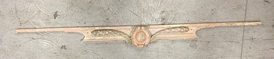 a wooden shelf with a decorative design on top of it