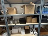 many boxes and boxes on the shelves in the room