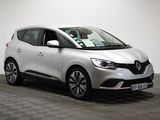 a white car is parked in a room with a checkered floor