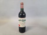 a bottle of wine that is sitting on a table