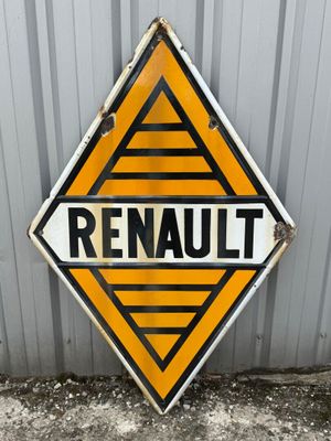 an orange and black sign with the word renault on it