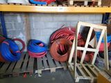 many different types of hoses on the shelves