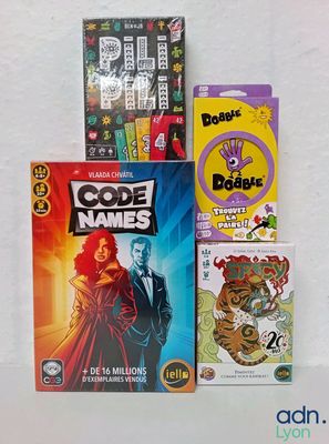 a lot of books and games on the table