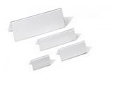 three pieces of clear acrylic display stands on a white surface
