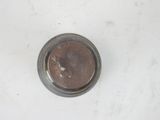 a small coin sitting on top of a white table