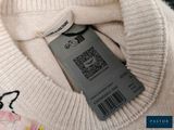 a picture of a white sweater with a price tag on it