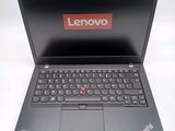 a laptop that has a lenovo logo on the screen