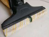 a yellow and black vacuum cleaner on the floor