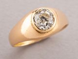 an image of a gold ring with a diamond in it