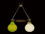two lights that are hanging from a wooden pole