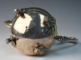 a silver object that is sitting on top of a table