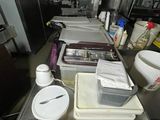 a long table with a lot of dirty dishes on it