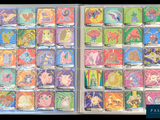 many different pokemon cards in a clear box