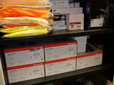 many bags of carrots on a shelf in a closet