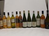 many bottles of wine lined up on the counter