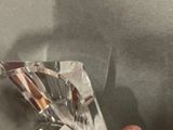 a person holding a crystal piece in their hand