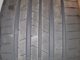 a close up of a tire on a shelf in a room