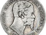 Gros plan sur une pièce de monnaie portant le visage d'un homme