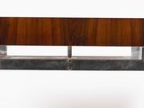 a wooden table with a metal base and a glass top