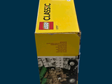 a box of legos sitting on a blue surface
