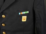 a military uniform with a medal on the chest and collar