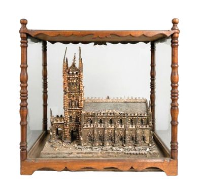 a miniature model of a cathedral in a glass case