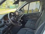the interior of a car with the door open and the driver ' s seat down