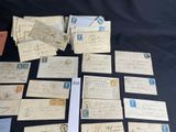 some old letters and envelopes are sitting on a table