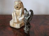 a figurine of a monkey and a bird on a table