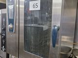 a picture of a commercial kitchen with stainless steel appliances