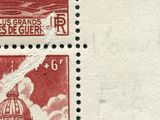 two stamps with a picture of a building on them on a black and white background