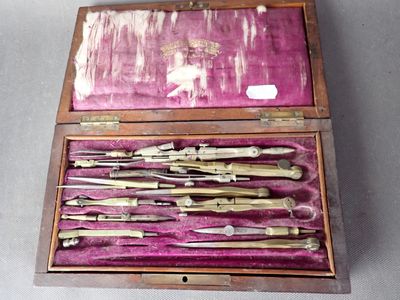 a wooden box with a bunch of tools inside of it
