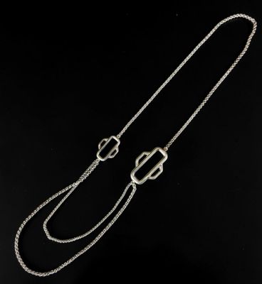 a silver chain with a clasp on a black background