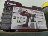 the box is open to show the contents of the titan paint sprayer