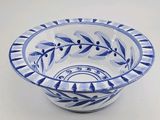 an image of a blue and white bowl sitting on a table