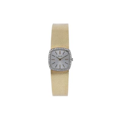a close up of a wrist watch with a diamond bezel