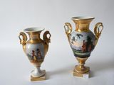 two vases that are sitting next to each other on a table