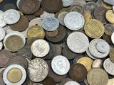 a lot of coins that are sitting on a table