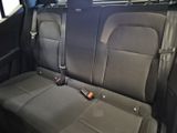 a seat in the back of a car with a remote control