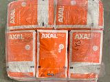 several bags of orange and white towels stacked on top of each other