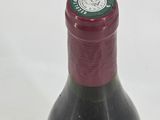 a bottle of wine that is sitting on a table