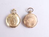 two gold lockes with a picture of a man and a woman on them