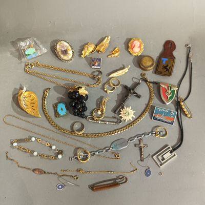 a lot of jewelry that is laying out on the table