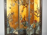 an image of a room divider with birds and flowers painted on it